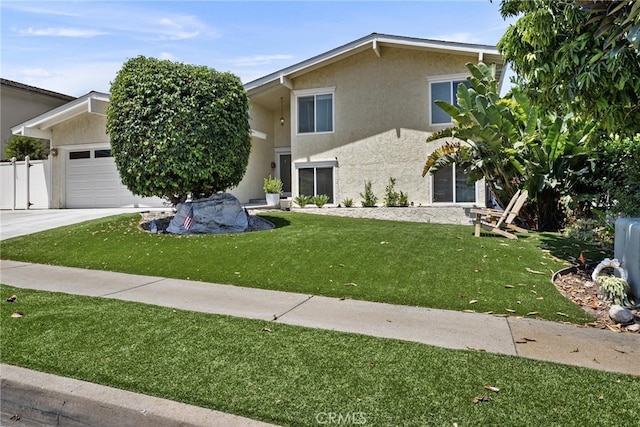view of front of property featuring stucco siding, a front yard, a garage, and driveway