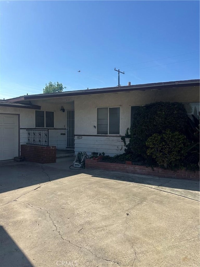 9611 Joyzelle Dr, Garden Grove, CA 92841 - single story home with stucco siding, covered porch, and an attached garage