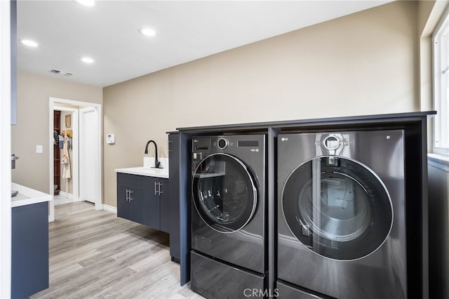 1325 N Birchnell Ave, San Dimas, CA 91773 - laundry room featuring washing machine and dryer, light wood-style flooring, recessed lighting, a sink, and baseboards