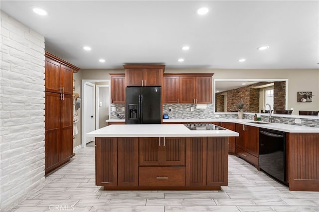 1325 N Birchnell Ave, San Dimas, CA 91773 - kitchen featuring black appliances, a sink, light countertops, a center island, and tasteful backsplash