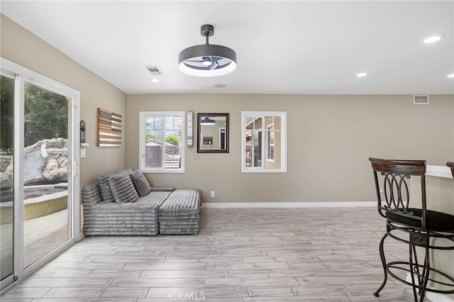1325 N Birchnell Ave, San Dimas, CA 91773 - sitting room with plenty of natural light, wood tiled floors, recessed lighting, and baseboards