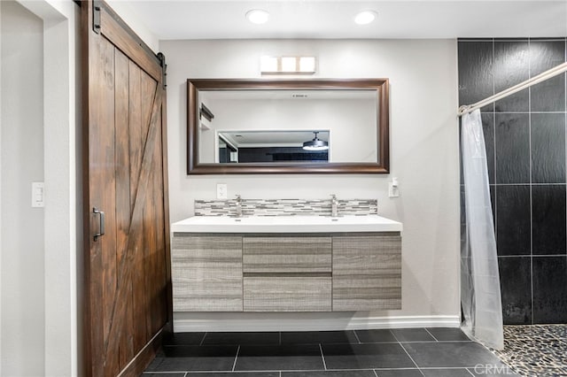 1325 N Birchnell Ave, San Dimas, CA 91773 - bathroom featuring a stall shower, double vanity, tile patterned flooring, baseboards, and recessed lighting