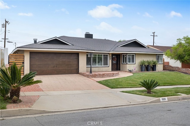 1325 N Birchnell Ave, San Dimas, CA 91773 - ranch-style home featuring a garage, decorative driveway, a front yard, stucco siding, and a chimney