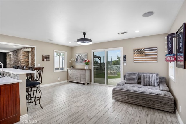 1325 N Birchnell Ave, San Dimas, CA 91773 - living room featuring baseboards, light wood-style floors, and recessed lighting
