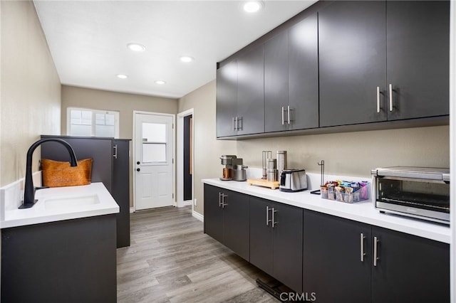 1325 N Birchnell Ave, San Dimas, CA 91773 - kitchen with dark cabinets, recessed lighting, and light countertops