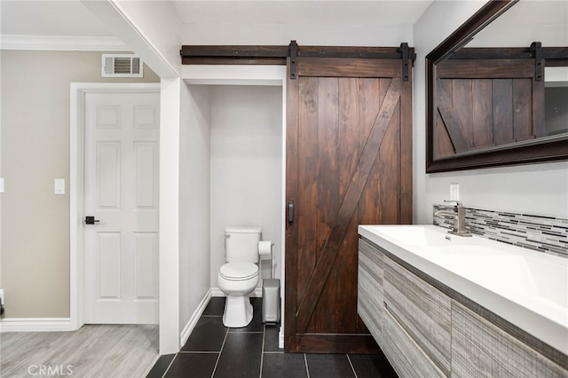 1325 N Birchnell Ave, San Dimas, CA 91773 - bathroom featuring toilet, vanity, ornamental molding, decorative backsplash, and baseboards