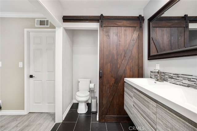 1325 N Birchnell Ave, San Dimas, CA 91773 - bathroom with toilet, double vanity, crown molding, baseboards, and backsplash