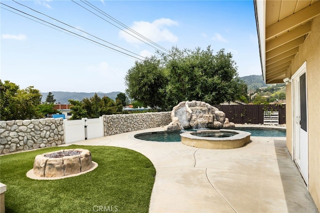 1325 N Birchnell Ave, San Dimas, CA 91773 - view of yard with an outdoor fire pit, a mountain view, a patio, and a pool with connected hot tub