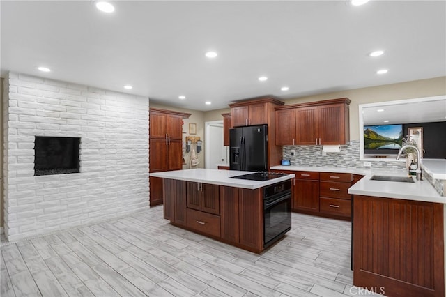 1325 N Birchnell Ave, San Dimas, CA 91773 - kitchen with black appliances, a sink, light countertops, recessed lighting, and tasteful backsplash