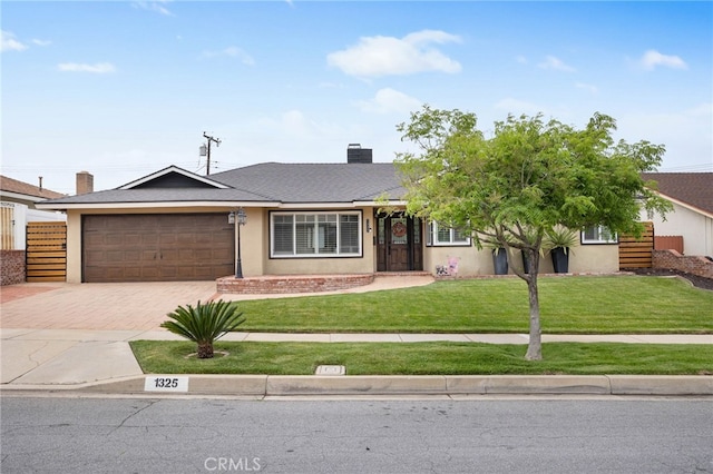 1325 N Birchnell Ave, San Dimas, CA 91773 - ranch-style home with decorative driveway, an attached garage, a front yard, a chimney, and stucco siding