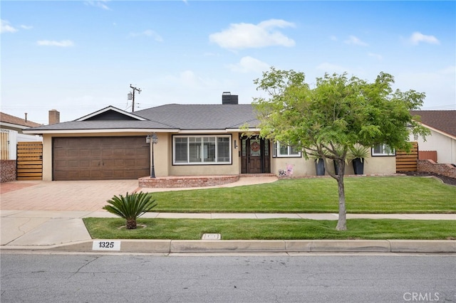 1325 N Birchnell Ave, San Dimas, CA 91773 - single story home featuring decorative driveway, a garage, a front lawn, a chimney, and stucco siding