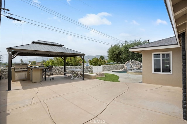 1325 N Birchnell Ave, San Dimas, CA 91773 - view of patio with a gazebo, grilling area, outdoor dining space, fence, and a mountain view