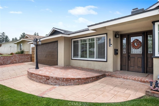 1325 N Birchnell Ave, San Dimas, CA 91773 - doorway to property with stucco siding and a garage