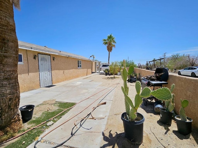 view of patio featuring fence