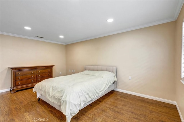 2262 Via Puerta Unit A, Laguna Woods, CA 92637 - bedroom featuring wood finished floors, baseboards, crown molding, and recessed lighting