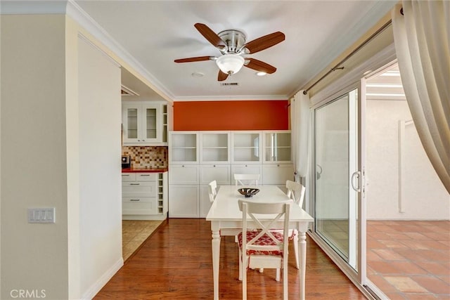 2262 Via Puerta Unit A, Laguna Woods, CA 92637 - dining space with ceiling fan and ornamental molding