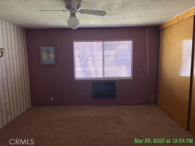 17216 Cedar Way, Clearlake Oaks, CA 95423 - carpeted spare room featuring a textured ceiling, ceiling fan, and a wall unit AC