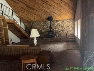 17216 Cedar Way, Clearlake Oaks, CA 95423 - unfurnished room with a wood stove, wood ceiling, and high vaulted ceiling