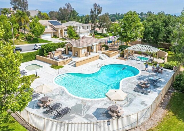 27567 Courtview Dr, Valencia, CA 91354 - community pool featuring a patio, fence, and a hot tub