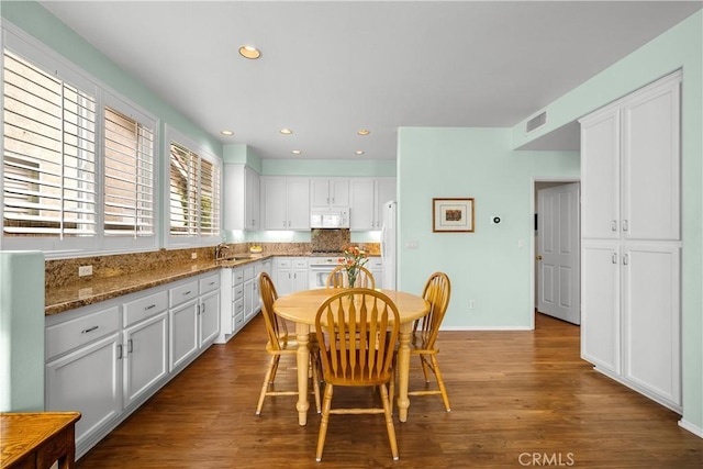 27567 Courtview Dr, Valencia, CA 91354 - dining room featuring wood finished floors, baseboards, and recessed lighting