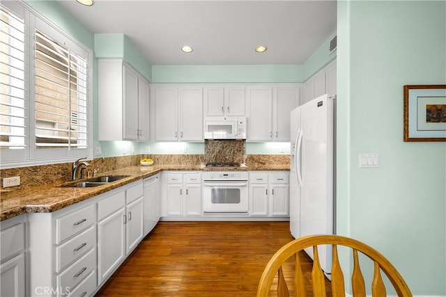 27567 Courtview Dr, Valencia, CA 91354 - kitchen with white appliances, white cabinetry, stone counters, dark wood-style floors, and recessed lighting