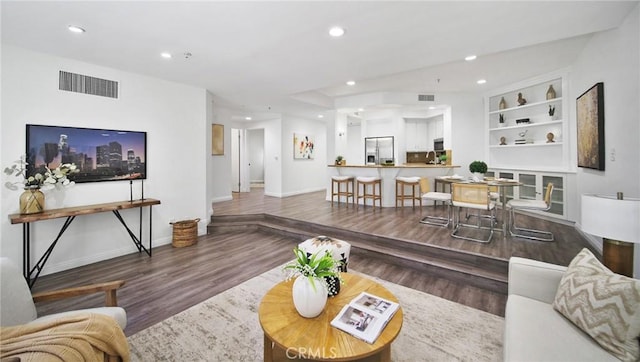 235 Main St Unit 118, Venice, CA 90291 - living room with wood finished floors, recessed lighting, and built in features