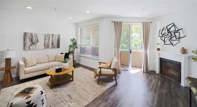 235 Main St Unit 118, Venice, CA 90291 - living area with dark wood-style floors, a glass covered fireplace, and recessed lighting