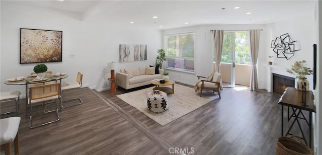 235 Main St Unit 118, Venice, CA 90291 - living area with dark wood-style floors, a glass covered fireplace, and recessed lighting