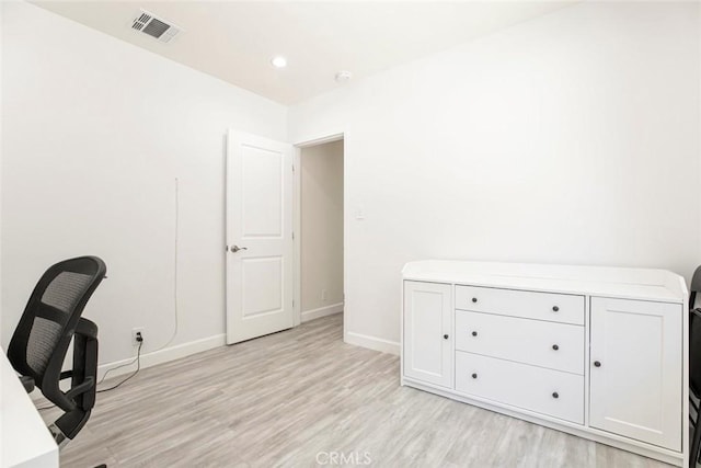 office featuring light wood-style flooring, baseboards, and recessed lighting