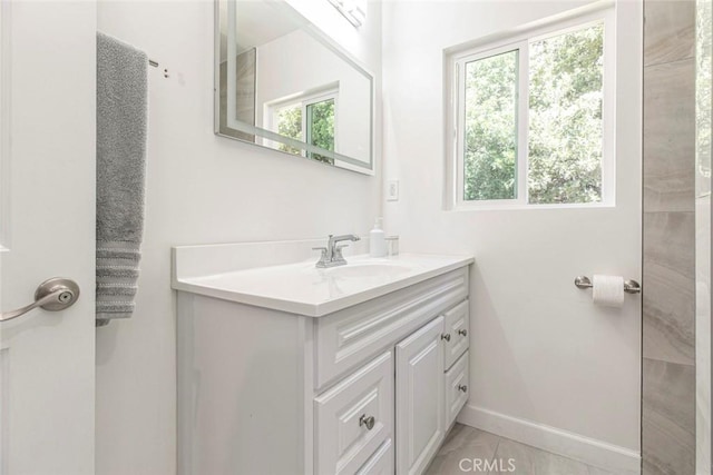 bathroom featuring vanity and baseboards