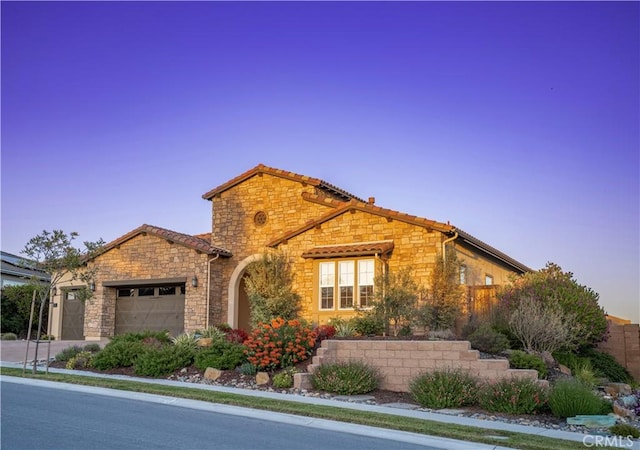851 Trail View Pl, Nipomo, CA 93444 - view of front of property featuring stone siding, an attached garage, fence, and concrete driveway