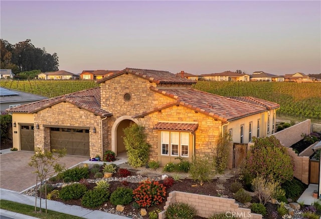 851 Trail View Pl, Nipomo, CA 93444 - view of front facade with stone siding, a garage, a tile roof, driveway, and stucco siding