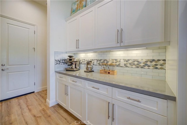851 Trail View Pl, Nipomo, CA 93444 - bar area with decorative backsplash, light wood finished floors, and baseboards