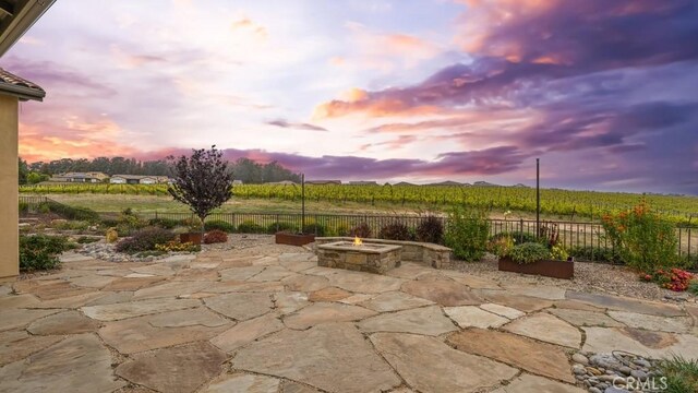 851 Trail View Pl, Nipomo, CA 93444 - patio terrace at dusk featuring a fire pit and a patio