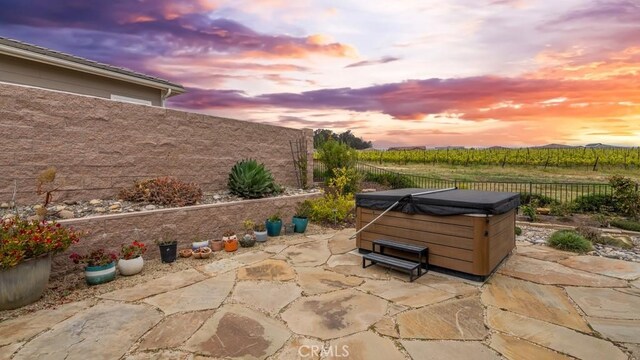 851 Trail View Pl, Nipomo, CA 93444 - fenced backyard featuring a hot tub, a patio area, a rural view, and agricultural plots