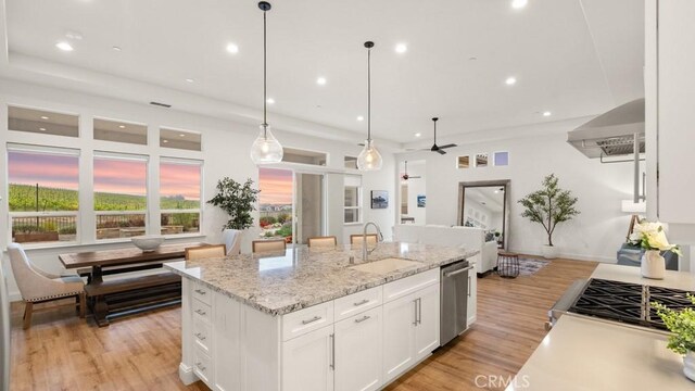 851 Trail View Pl, Nipomo, CA 93444 - kitchen featuring dishwasher, recessed lighting, white cabinets, wall chimney range hood, and light wood-type flooring