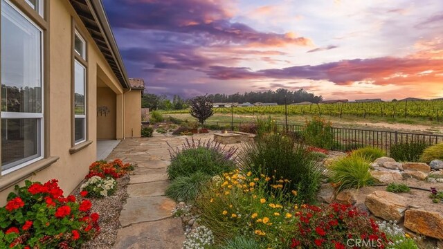 851 Trail View Pl, Nipomo, CA 93444 - view of yard featuring an outdoor fire pit, a patio area, agricultural area, and a view of rural / pastoral area