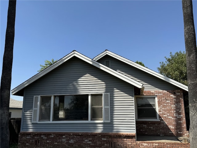 35226 Ave C, Yucaipa, CA 92399 - view of side of home featuring brick siding