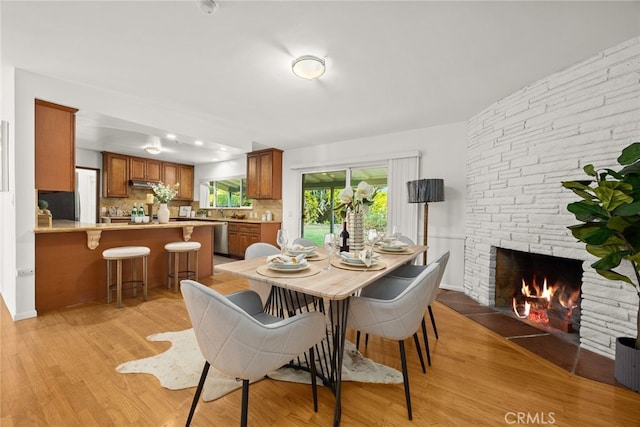 2520 Louise Ave, Arcadia, CA 91006 - dining space with light wood-type flooring and a stone fireplace