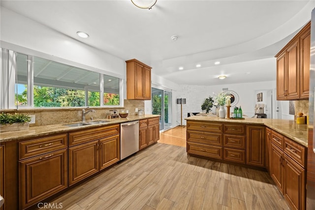 2520 Louise Ave, Arcadia, CA 91006 - kitchen featuring stainless steel dishwasher, a sink, brown cabinetry, light wood-type flooring, and tasteful backsplash