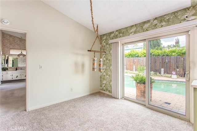2605 La Praix St, Highland, CA 92346 - unfurnished dining area with carpet, baseboards, and wallpapered walls