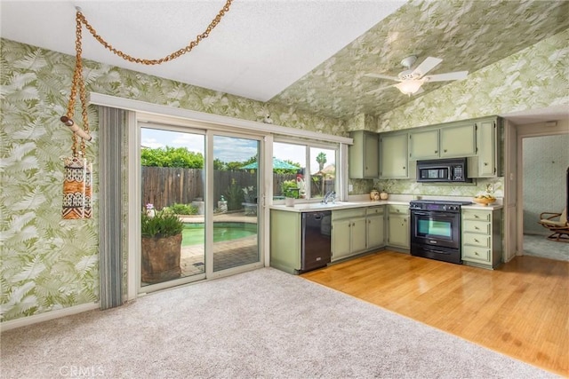 2605 La Praix St, Highland, CA 92346 - kitchen with black appliances, green cabinetry, wallpapered walls, light countertops, and a ceiling fan