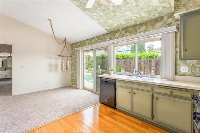 2605 La Praix St, Highland, CA 92346 - kitchen with black dishwasher, a sink, wallpapered walls, light countertops, and light wood-style flooring