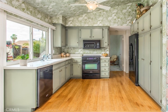 2605 La Praix St, Highland, CA 92346 - kitchen featuring black appliances, a sink, wallpapered walls, light wood-style floors, and light countertops