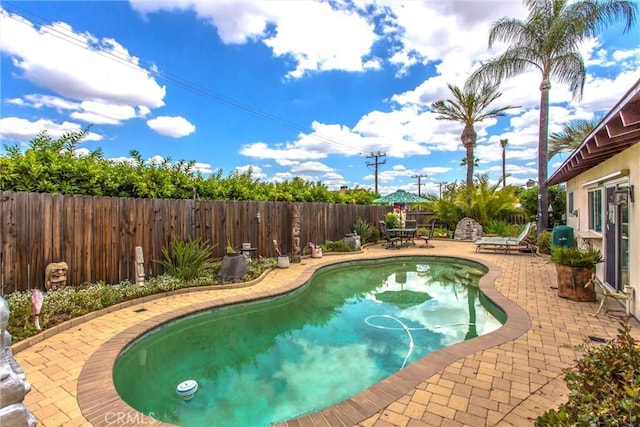 2605 La Praix St, Highland, CA 92346 - view of swimming pool featuring a patio area and a fenced backyard