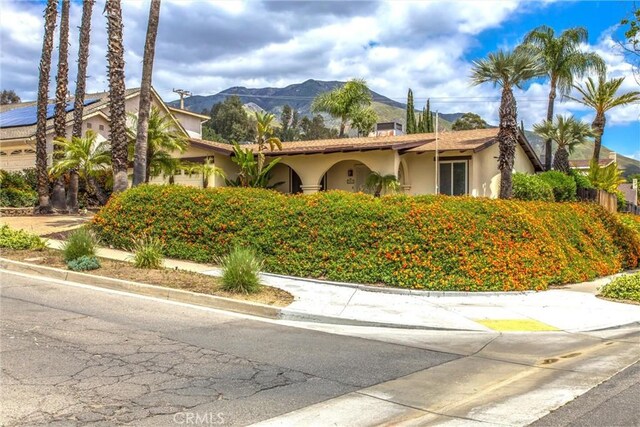 2605 La Praix St, Highland, CA 92346 - view of front facade with stucco siding and a mountain view