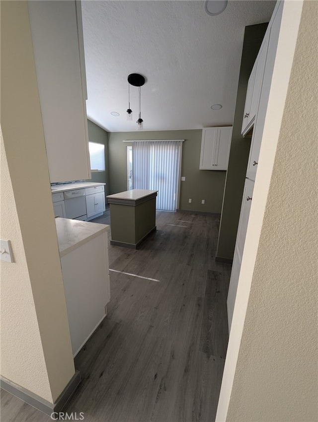 10736 Dove Ct, Adelanto, CA 92301 - hallway featuring dark wood-style flooring, a textured wall, a textured ceiling, and baseboards