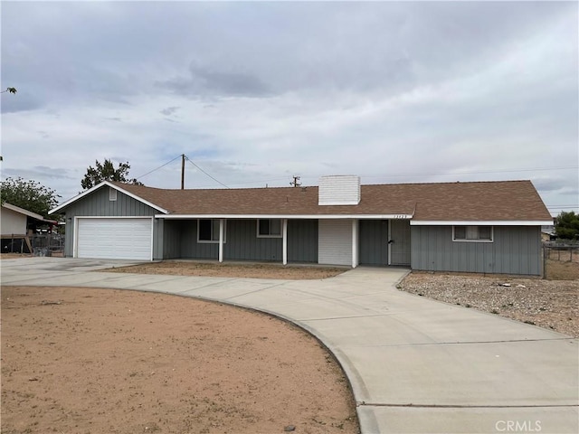 13429 Rancherias Rd, Apple Valley, CA 92308 - ranch-style home featuring concrete driveway, a garage, and a shingled roof