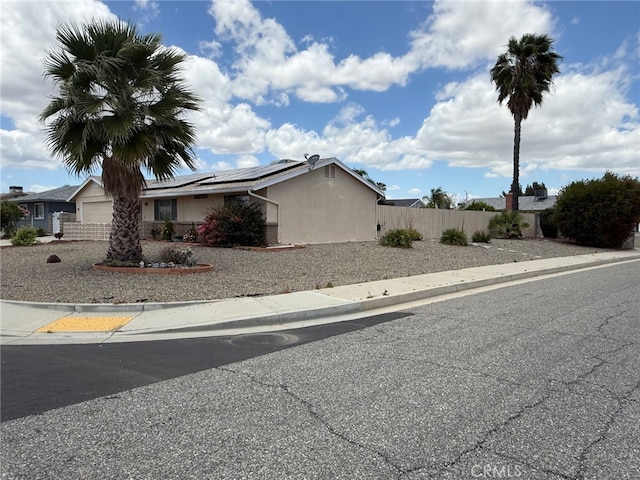 26284 Fairlane Dr, Menifee, CA 92586 - view of front of house with solar panels and stucco siding