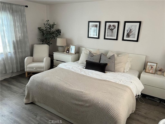 bedroom with wood finished floors